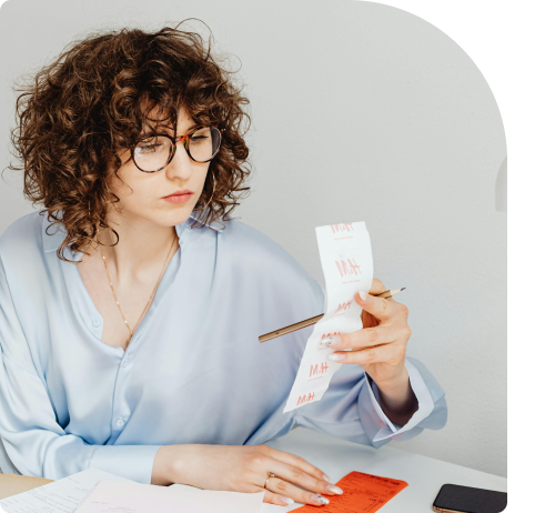 Woman looking at receipt