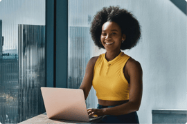 Woman seated in front of her laptop